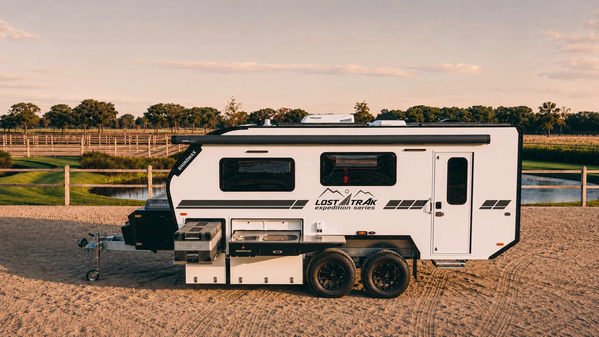 Rhinomax camper towed across remote Australian terrain at dusk